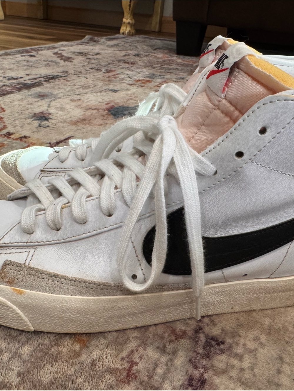 Nike White High-Top Sneakers with Black Swoosh and Tan Accents
